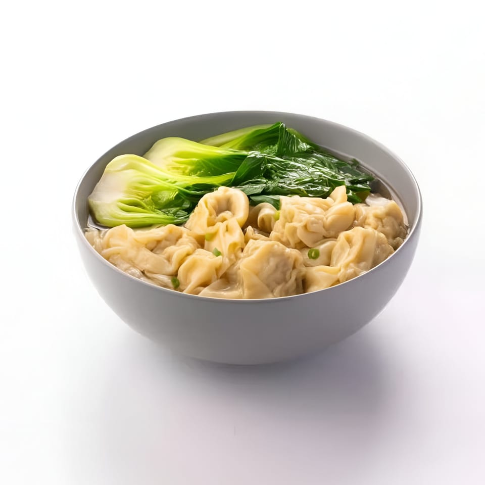 A grey bowl of Skye Thai wonton soup with bok choy and green onions on a white background.